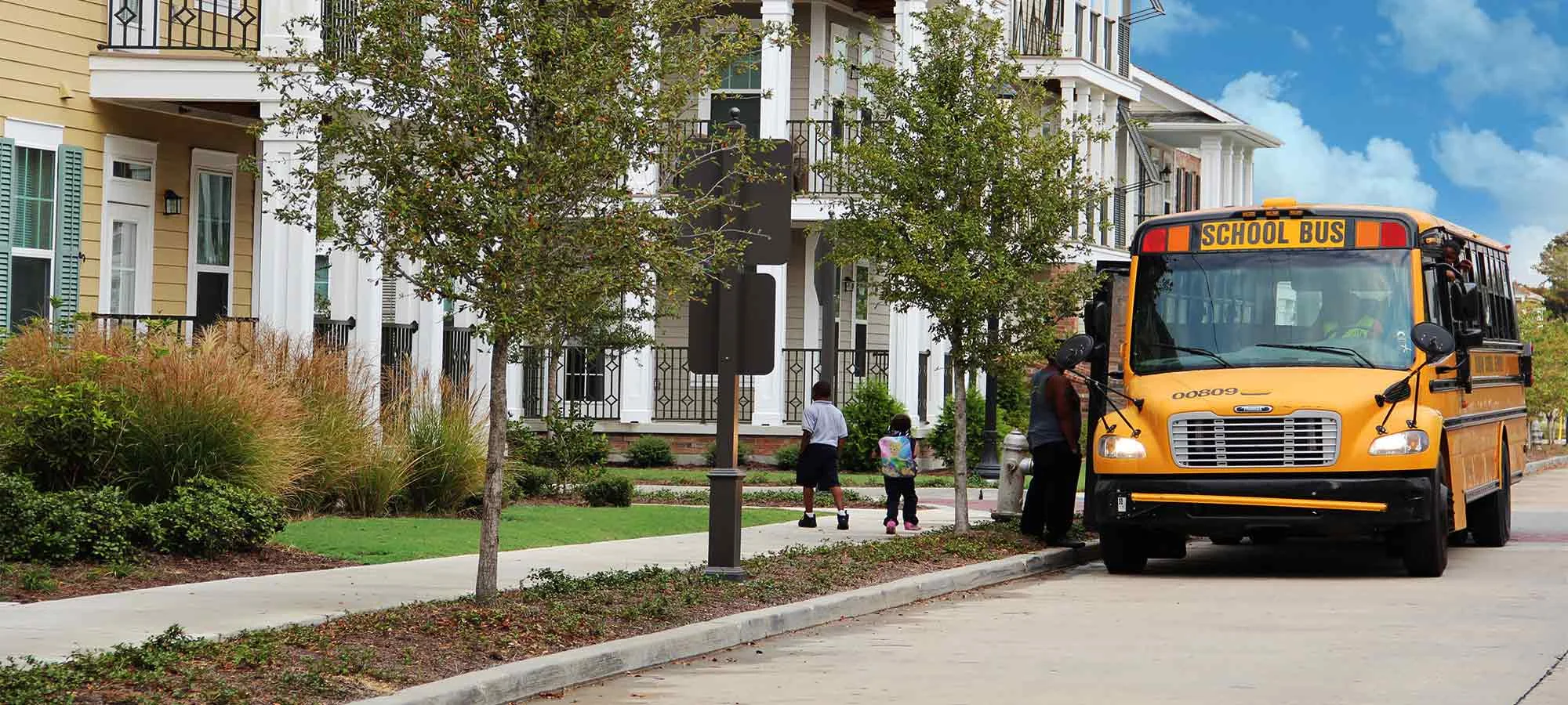 School bus pick up outside of HANO Housing